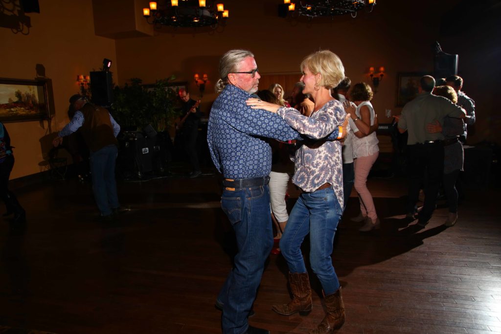 A couple dances to the music at the Boots Boogie and BBQ dinner