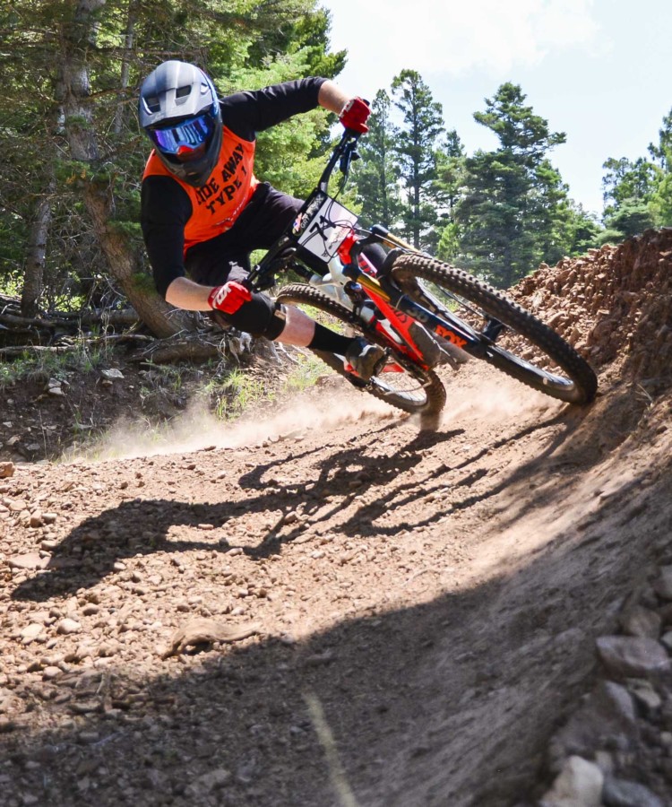 A mountain biker races during the Fire 5 Downhill Race Series