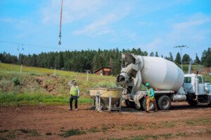 The helicopter about to grab another bucket of concrete.